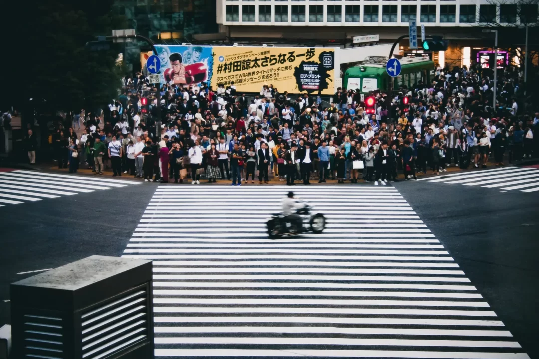 people waiting for red light in shibuya crossing