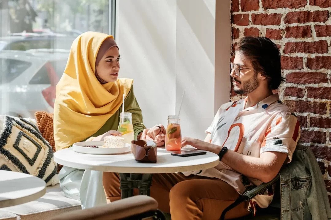 muslim people eating in cafe